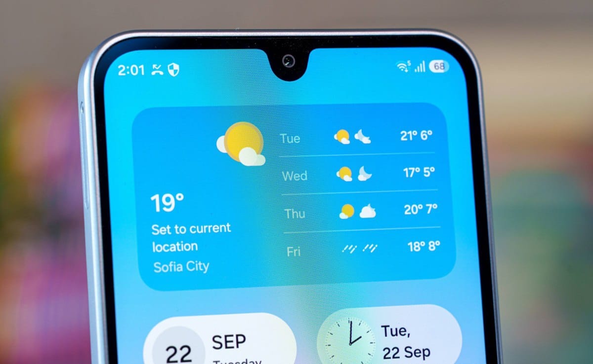 gsmarena_021 Close-up of a smartphone screen showing a weather widget with 4-day forecast and location Sofia City.