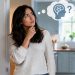 Woman standing in a doorway, stroking her chin and thinking, with a thought bubble showing a brain and a question mark above her.