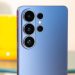 سامسونگ و گوگل قیمت گوشی های ارزان قیمت خود را افزایش می دهند 8 Blue smartphone rear with four camera lenses arranged in a vertical cluster and a small flash.