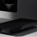 مایکروسافت Surface RTX Spark Dev Box را با قیمت 6000 دلار معرفی کرد 8 عکس تبلیغاتی با نورپردازی سینمایی از یک دستگاه کامپیوتر کوچک مشکی با بدنهی مشبکِ تهویه که روی میز سفید براق قرار گرفته و در پسزمینه، قسمت پایین یک نمایشگر روشن با تصویر مشکی محو دیده میشود. سایهی واضح دستگاه و نور موضعی، زوایای تیز و لبهی براق بدنه را برجسته میکند و کل صحنه فضایی مینیمال و تیره دارد