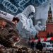 Rat in the foreground with a plague test tube, gloved hand, hazmat researchers, and Moscow's Red Square backdrop while a barrier is visible.