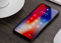 گزارش: پلیس ظاهرا یکی از امن ترین ویژگی های iOS را دور زده است 17 iPhone showing a passcode entry screen on a wooden desk with a coffee cup and keyboard nearby